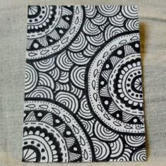 a piece of paper with black and white designs on it