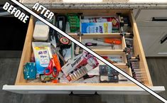 an open drawer filled with different items on top of a counter