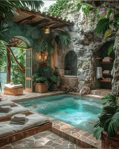 an indoor swimming pool surrounded by greenery