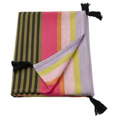 a multicolored blanket with tassels on it