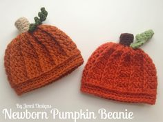 two knitted pumpkin hats sitting next to each other