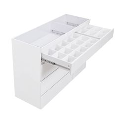 an open drawer with several compartments on the bottom and one section is shown in white