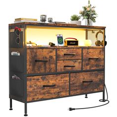 a large wooden dresser with drawers and lights on it's sides, in front of a white background