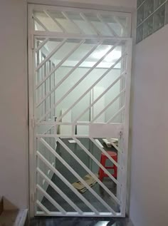 an open door leading to a cubicle with desks in the background