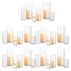 a set of twelve clear glass candles on a white background with one lit candle in the middle