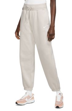 Get ready for the weekend in these high-rise, brushed-fleece sweatpants that fit loose through the hip and thigh for all-day comfort. 29 1/2" inseam; 12" leg opening; 13" front rise; 18" back rise (size Medium) Elastic/drawstring waist On-seam pockets 80% cotton, 20% polyester Machine wash, tumble dry Imported Nike Waffle Debut, Dior Miss Dior, Fall Wardrobe Essentials, Nike Waffle, Nike Sweatpants, Curvy Women Outfits, Fleece Sweatpants, Sports Blazer, Miss Dior