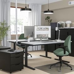 an office with two desks and one chair in front of the computer monitor on the desk