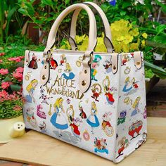 Buy Alice In Wonderland Disney Leather HandBag is designed & sold by Wayfarer Bumper. SKU 87475825 listed on 10 16, 2023. Most ship worldwide within 24 hours. Delivery to the United States. Leather Bag Women Handbags, Personalized Leather Handbag, Custom Leather Bag, Alice In Wonderland Disney, Woman Handbag, Bags And Purses, Student Bag, Leather Bag Women, Handbag Wallet