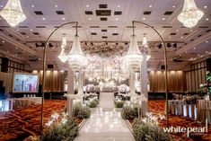 an elaborately decorated hall with chandeliers and flowers on the ceiling is shown