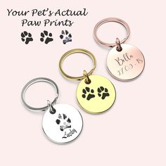 three personalized pet id tags with paw prints on them and the words, your pet's actual paw prints