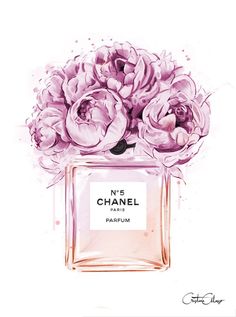 a chanel perfume bottle with pink flowers on it next to a black bag and wallet