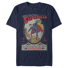 a blue superman t - shirt with the title's image on it, in front of