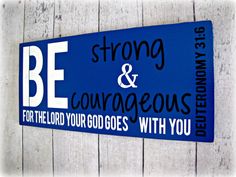 a blue and white sign that says be strong and courageous for the lord your god goes with you