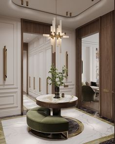 a living room with white walls and marble flooring, chandelier above a round table surrounded by green chairs