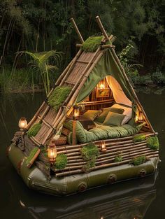 an inflatable bed is floating on the water with candles and lights around it