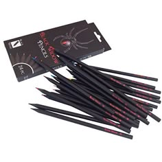 black pencils with red writing on them are sitting in front of a card and box