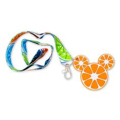 a lanyard with an orange cut in half and mickey mouse head on the side