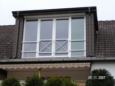 an open window on the side of a house