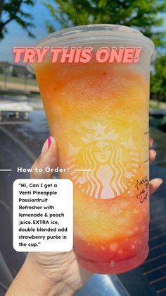 a person holding up a cup with an advertisement on the side of it that says try this one