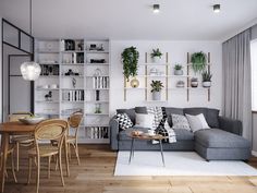 a living room filled with furniture next to a dining table and bookshelf in front of a window