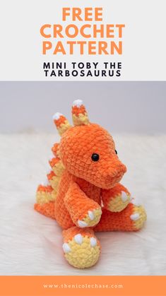 an orange crochet dragon sitting on top of a white blanket with text overlay that reads free crochet pattern mini to try the tardosaurus