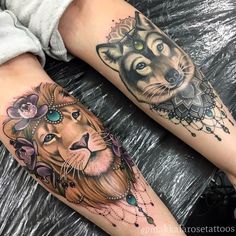 two people with tattoos on their legs, one has a lion and the other is a tiger