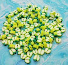 green and white plastic beads on blue water