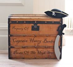 an old trunk with a pirate hat on top