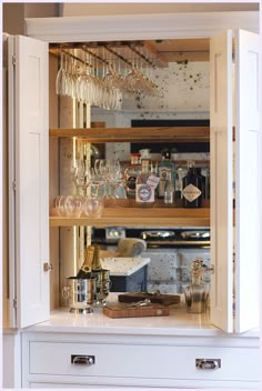 a cabinet filled with lots of wine glasses