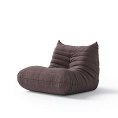 a brown bean bag chair sitting on top of a white floor