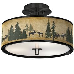 a semi flush ceiling light with moose silhouettes and trees on the fabric drum shade