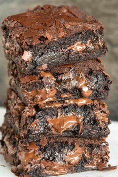 chocolate brownies stacked on top of each other