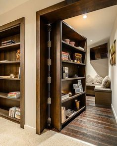 an open bookcase in the corner of a room with carpeted floor and walls