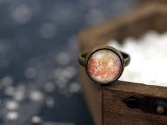 Beautiful and unique ring with one of Jupiter's Moons - Europa. Ring size is adjustable, diameter of the image is 12mm. ☀ You can see more from Sun and Stars Jewelry here - sunandstarsjewelry.etsy.com⋆ More Space Jewelry - https://www.etsy.com/shop/SunAndStarsJewelry?section_id=14349961&ref=shopsection_leftnav_1----------------------------------------------------☀ Product care:⋆ avoid contact with water (bathing, swimming), the jewelry is water resistant, but not water proof.⋆ almost all of Space Ring, Stars Jewelry, Jupiter Moons, Space Rings, Galaxy Universe, Space Space, Space Jewelry, Moon Ring, Sun And Stars