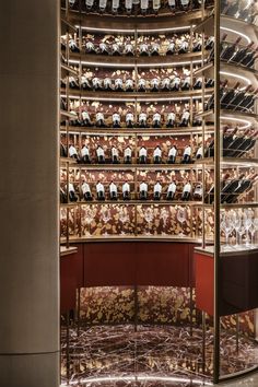 a wine cellar filled with lots of bottles and glasses