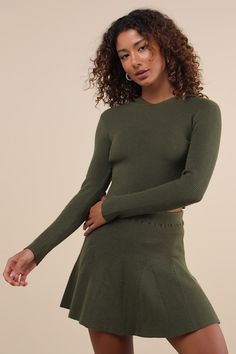 You'll embody the coziest and cutest vibes with a look like the Lulus Delightful Duo Olive Ribbed Hooded Two-Piece Sweater Mini Dress! Stretchy ribbed sweater knit shapes this two-piece set, that starts with a hooded top with long sleeves and a fitted, cropped bodice. The matching skirt features a high, elasticized waistband and a skater-style silhouette with seamed godet details and a flirty mini hem. Fit: This garment fits true to size. Length: Mid-thigh. Size medium Bust: Great for any cup si Godet Dress, Hooded Sweater Dress, Sweater Mini Dress, Top With Long Sleeves, Pleated Mini Dress, Hooded Top, Fall Fits, Mini Sweater Dress, Skater Style