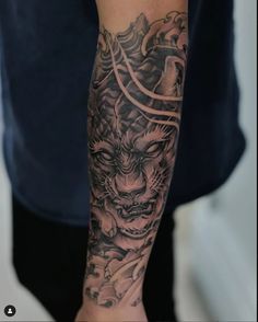 a man with a dragon tattoo on his arm