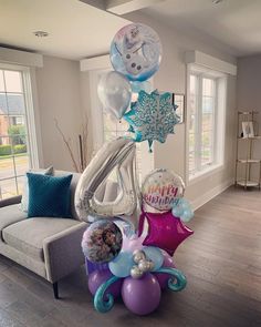 balloons and decorations in the shape of numbers for a frozen princess themed birthday party at home