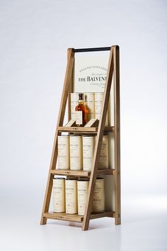 a wooden shelf with several bottles on it