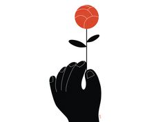 a person's hand holding a flower in the shape of a heart on a white background