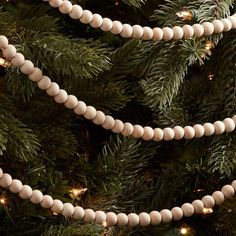 a close up of a christmas tree with beads