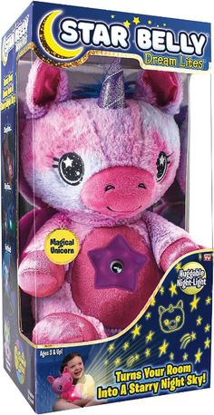 a pink stuffed animal with a unicorn on it's head in a packaging box