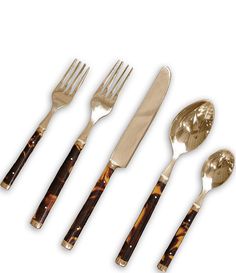 five pieces of silverware with tortoiseshell handles