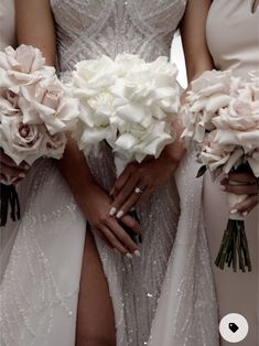 the bride is holding her bouquet of white roses in her left hand and wearing a wedding dress with sequins on it