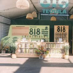 an outdoor market with lots of plants on display