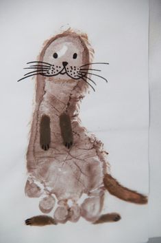 a child's drawing of a cat sitting on its hind legs