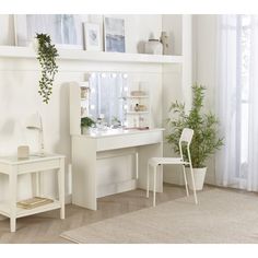 a white desk and chair in a room