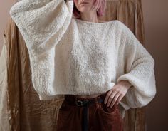 "Super soft and lightweight sweater with balloon sleeves from alpaca/wool blend. Materials: 80% Alpaca, 15% Wool, 5% Polyamide Color of the modeled sweater: off white; ocean Measurements: Length: front 17,7\" = 45 cm back 19,6\" = 48 cm Chest: 32\" = 81 cm Measures of Model in the photo Size: S Chest: 32\" - 82 cm Weist: 24\" - 62 сm Hip: 34\" - 88 cm Height: 66\" - 170 cm CARE INSTRUCTIONS: DRY CLEAN is the best way. HAND WASH. Make sure to use cold water and neutral soap. The less you touch an Cozy Sweater With Balloon Sleeves And Soft Knit, Cozy Balloon Sleeve Sweater, Oversized Soft Knit Sweater With Balloon Sleeves, Oversized Balloon Sleeve Sweater In Soft Knit, Cozy Oversized Tops With Balloon Sleeves, Cozy Mohair Long Sleeve Tops, Oversized Knit Sweater With Balloon Sleeves, Cozy Long Sleeve Mohair Top, Oversized Alpaca Chunky Knit Sweater