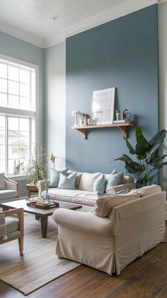 Want a Dreamy Living Room? Try One of These 17  Light Blue Wall Ideas Living Room With Light Blue Couch, Blue Walls Living Room Decor, Best Wall Colors For Living Room, Light Teal Living Room, Blue Wall Living Room, Blue Wall Ideas, Blue Accent Wall Living Room, Beige Sofa Living Room, Blue Accent Wall