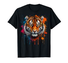 a tiger with colorful paint splatters on it's face